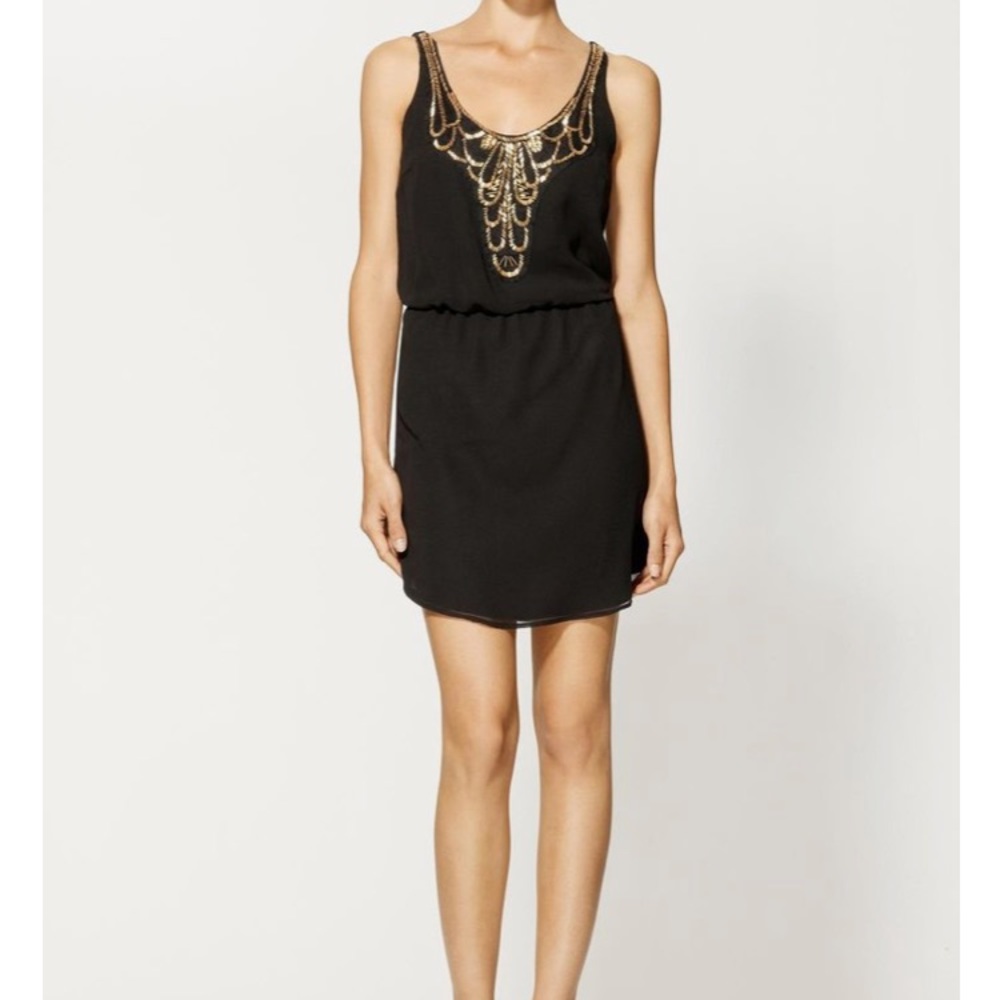Black cocktail dress w/ gold detailing!